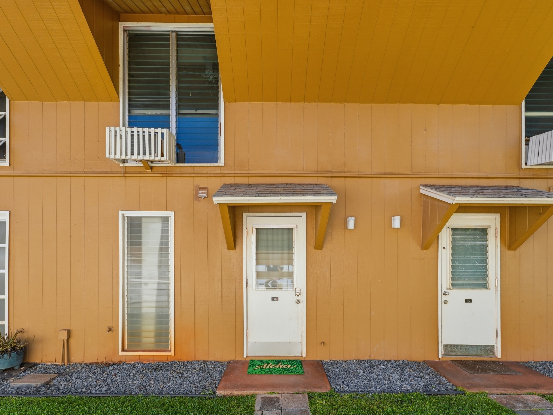Front entry door of unit 34 with Aloha welcome mat