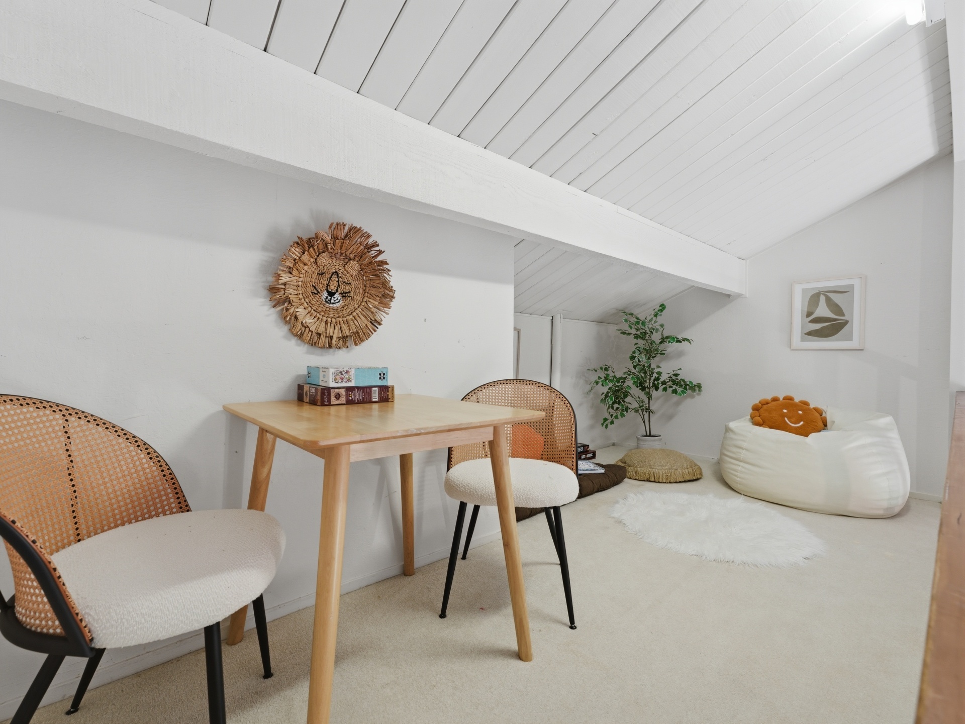 Finished loft with table, chairs and cozy bean bag reading nook