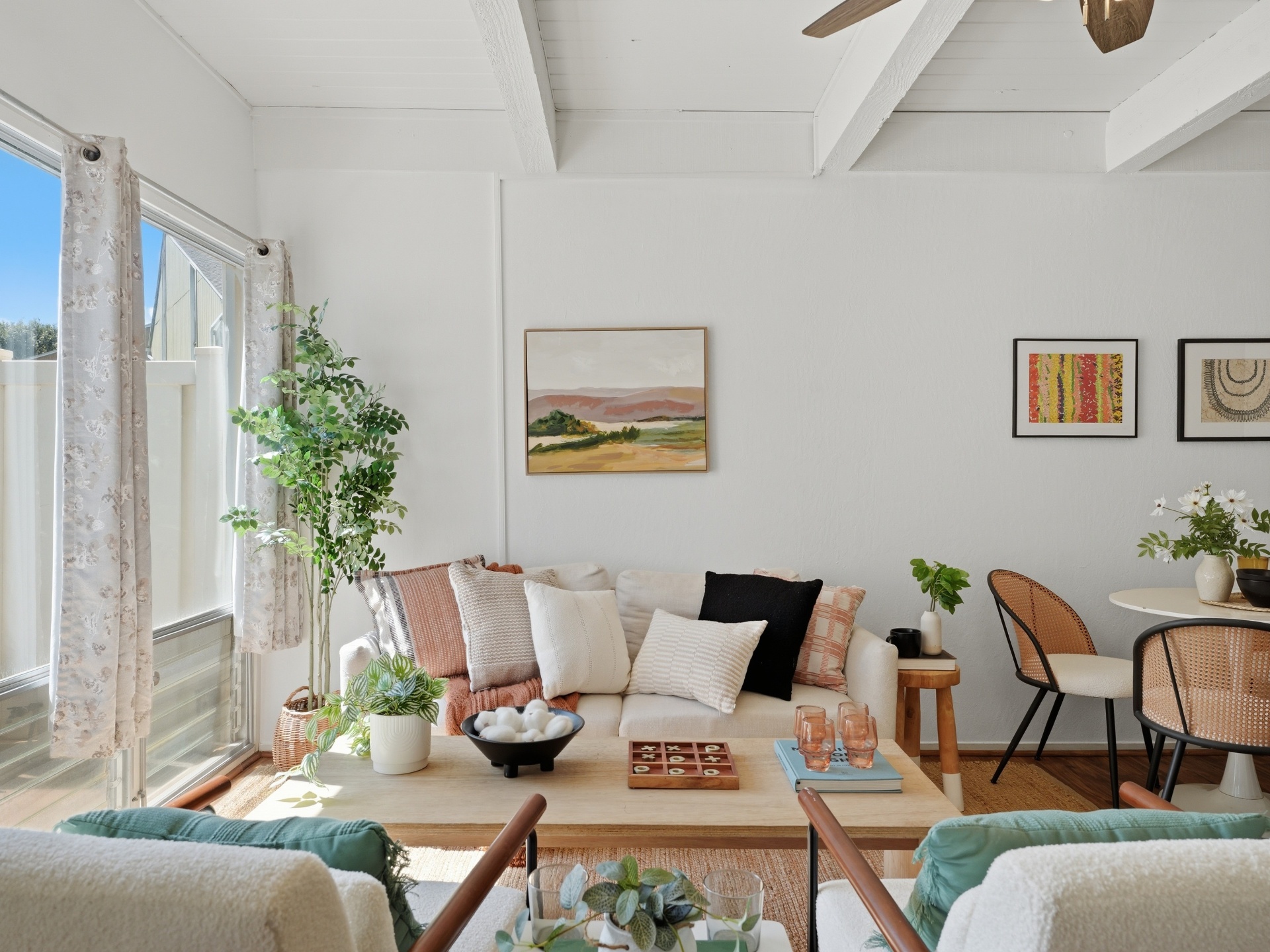 Cozy sofa and coffee table with natural light and art