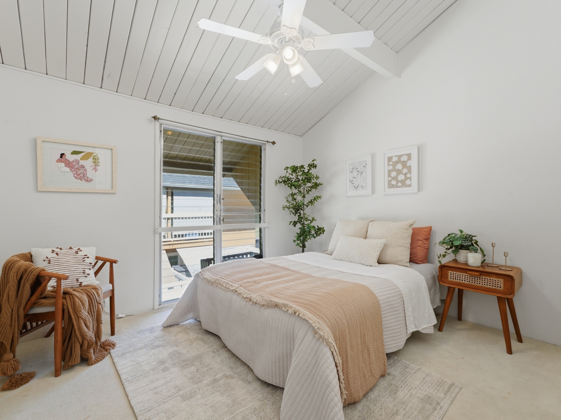 Second bedroom with vaulted shiplap ceiling, lanai access and natural light